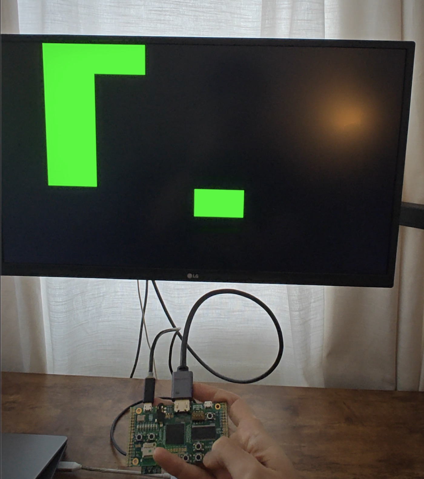 The Snake circuit running on a ULX3S FPGA, drawn on a monitor over HDMI